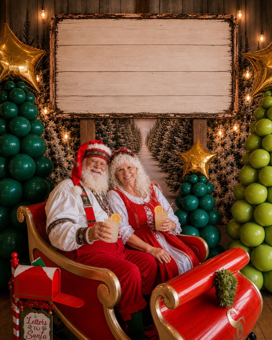 Santa and Mrs. Claus relaxing in a red sleigh with fresh lemonades
